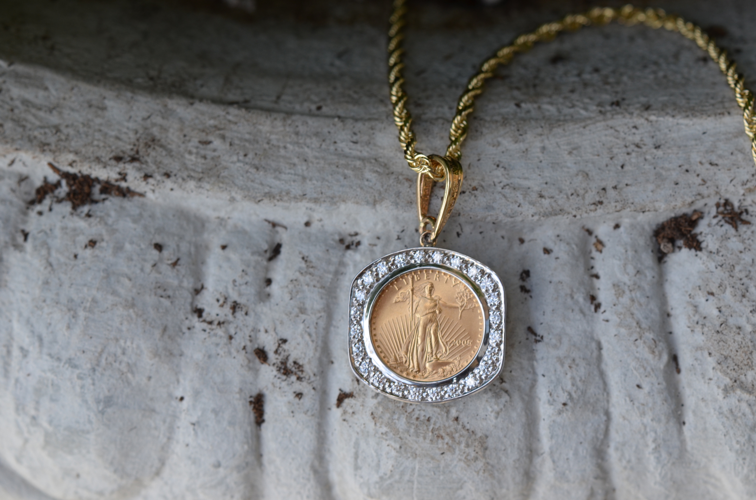 American Eagle 1/10th ounce gold coin, framed in diamond pave' mount.