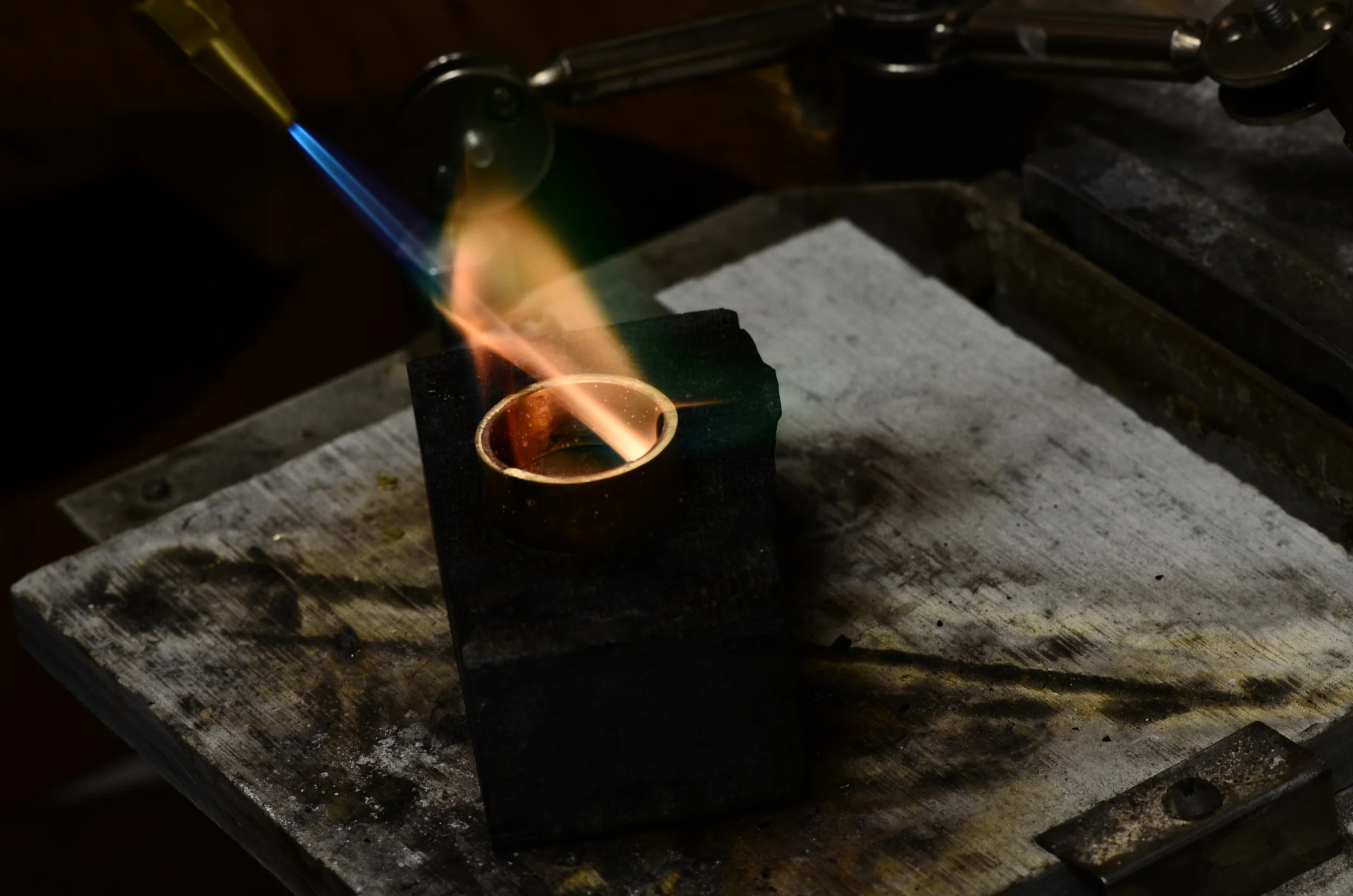 Gold in the crucible, beginning to be formed into a wearable jewel.