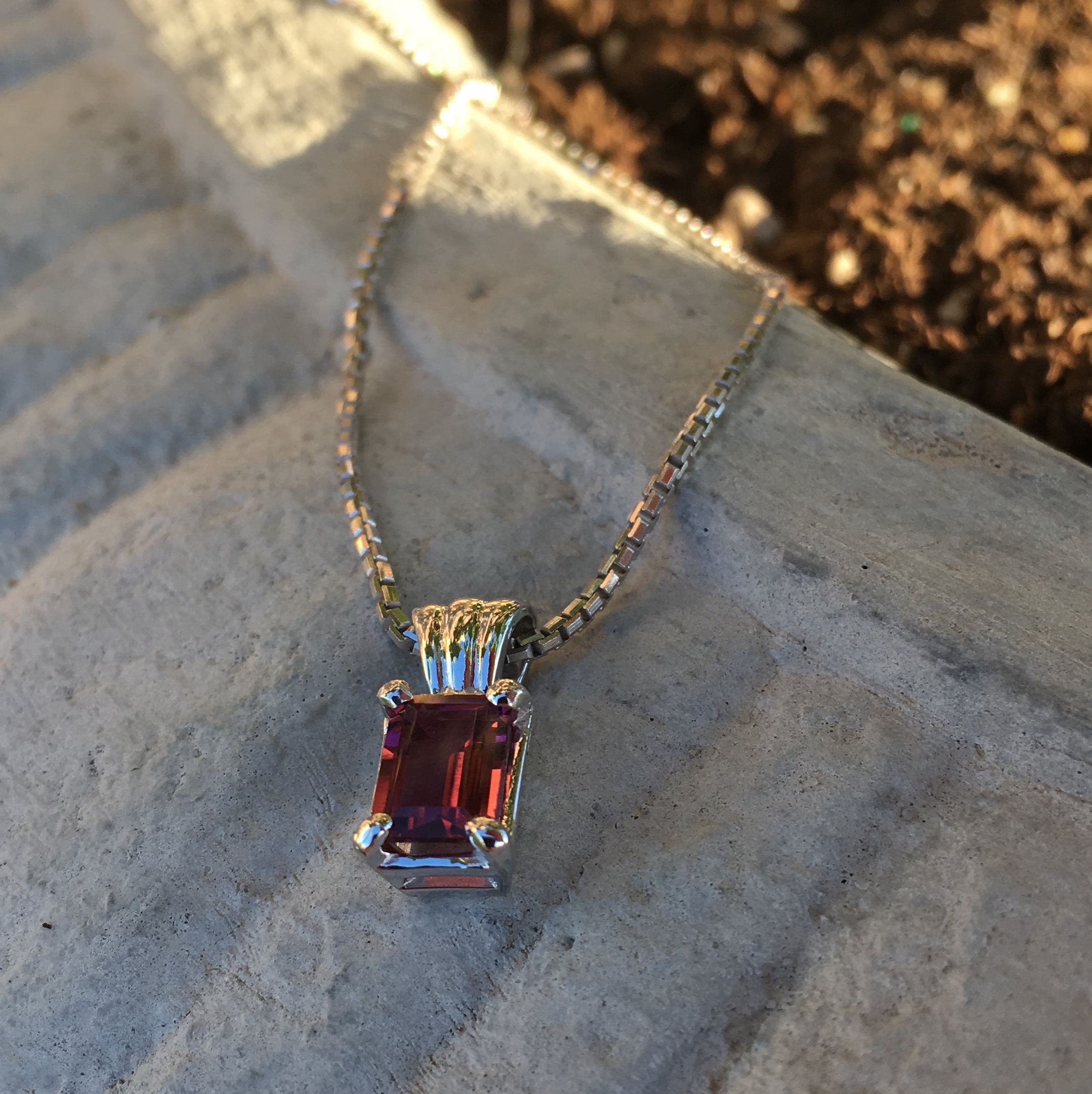 A rosy-pink Tourmaline set in Sterling Silver. A classic pendant design, hand-set in our shop.