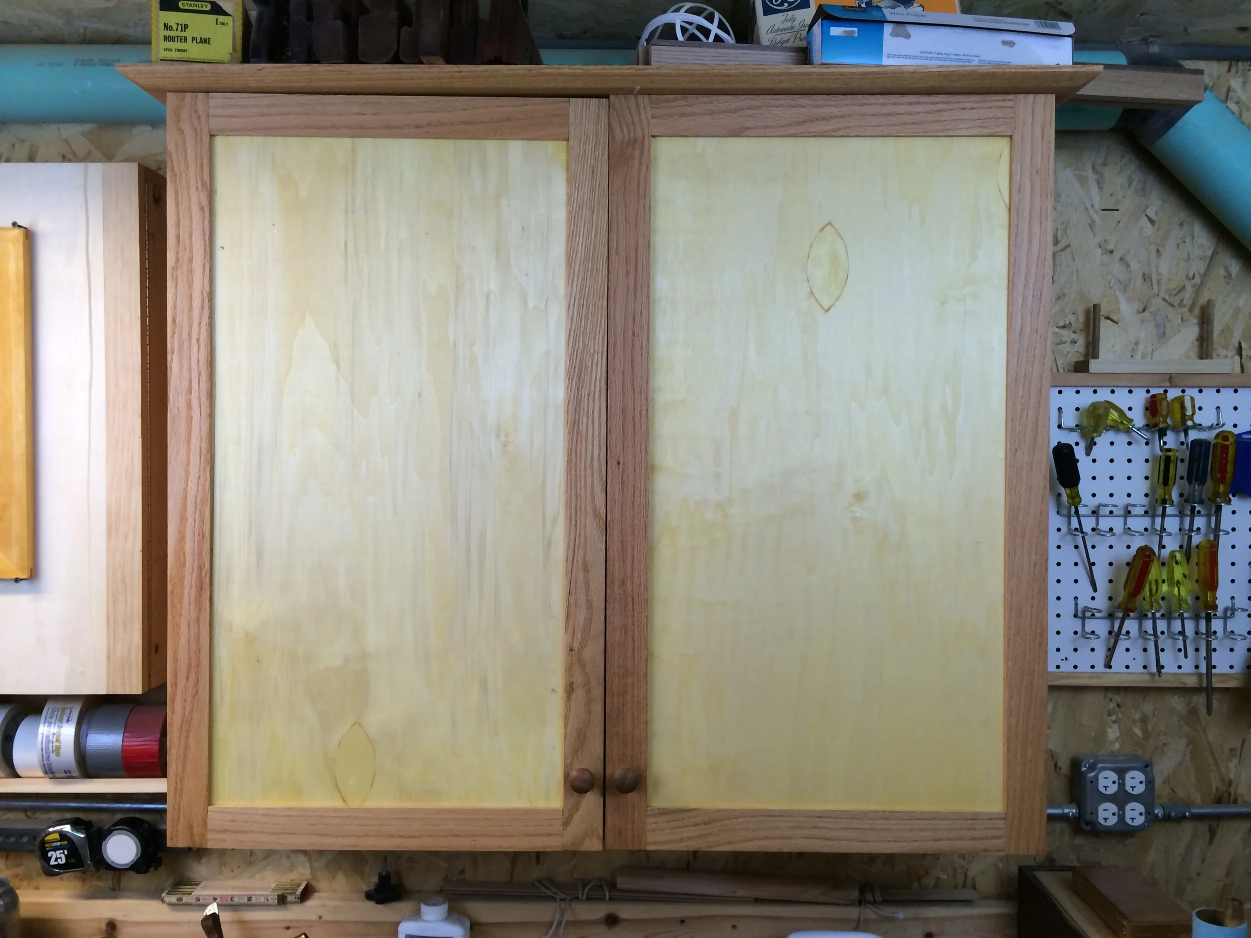 Not pretty, and that one door hangs a little crooked, but at least they're closed.