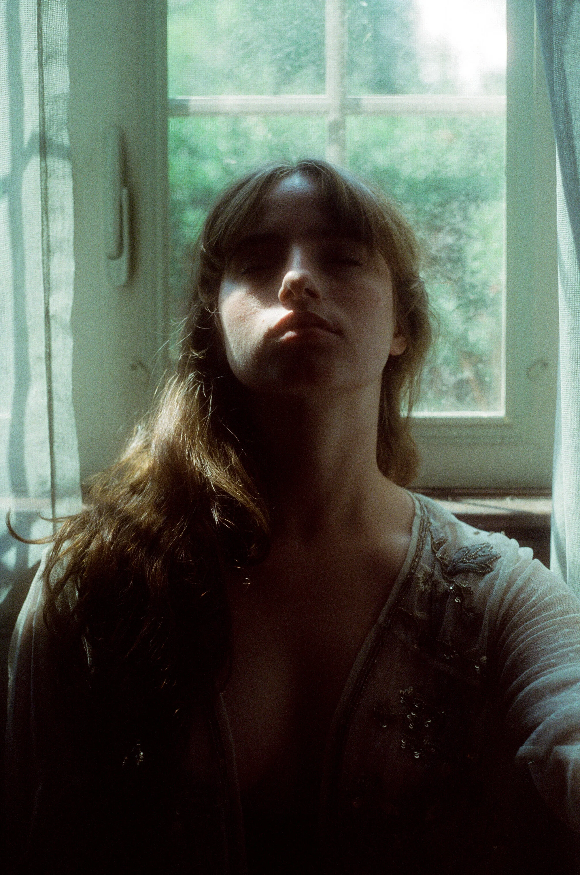 A 35mm portrait of Hana on Cinestill 800t film by Sarah Rose