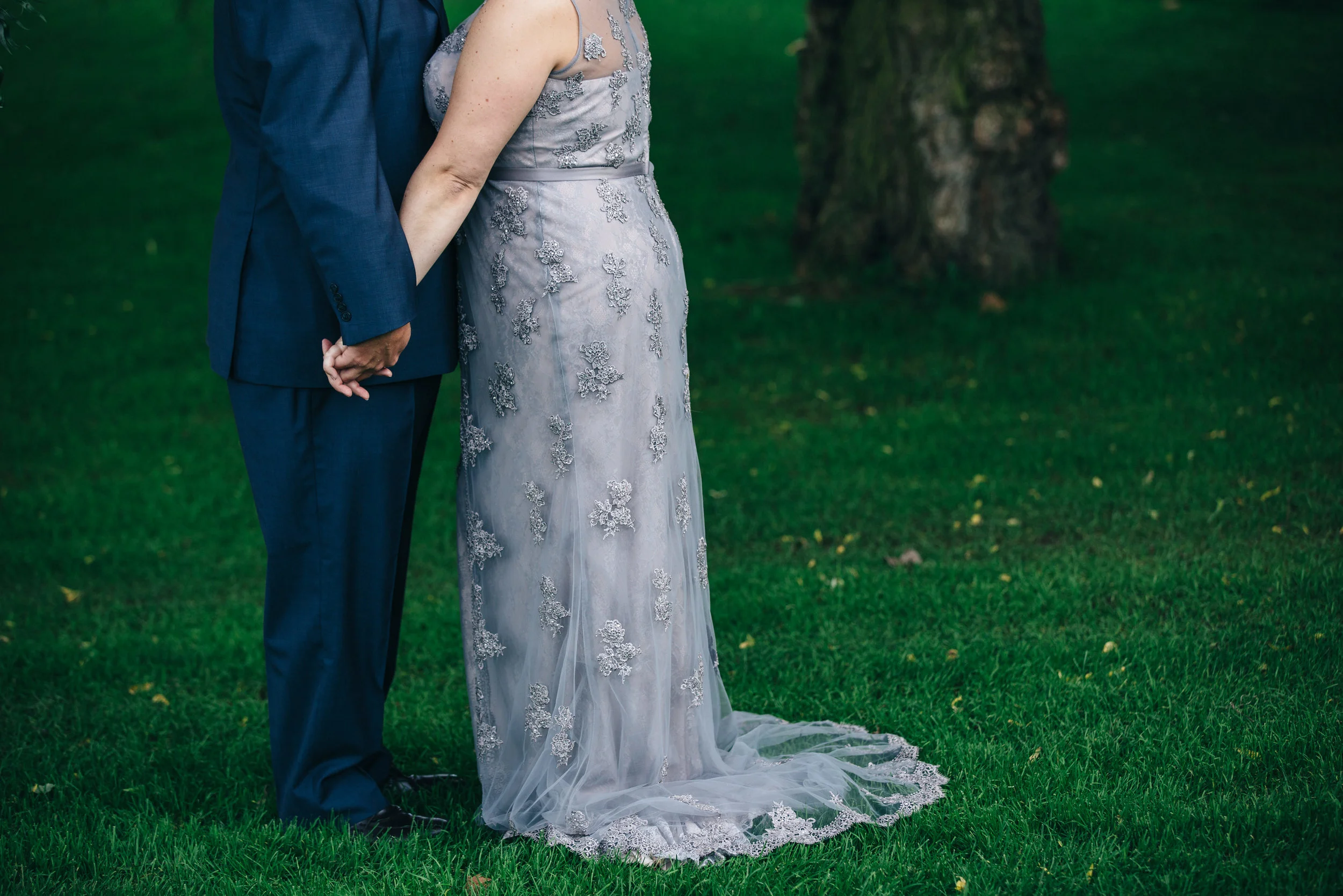 Groom's blue suit and purple lace wedding dress at Highland Meadows in Toledo, Ohio. 