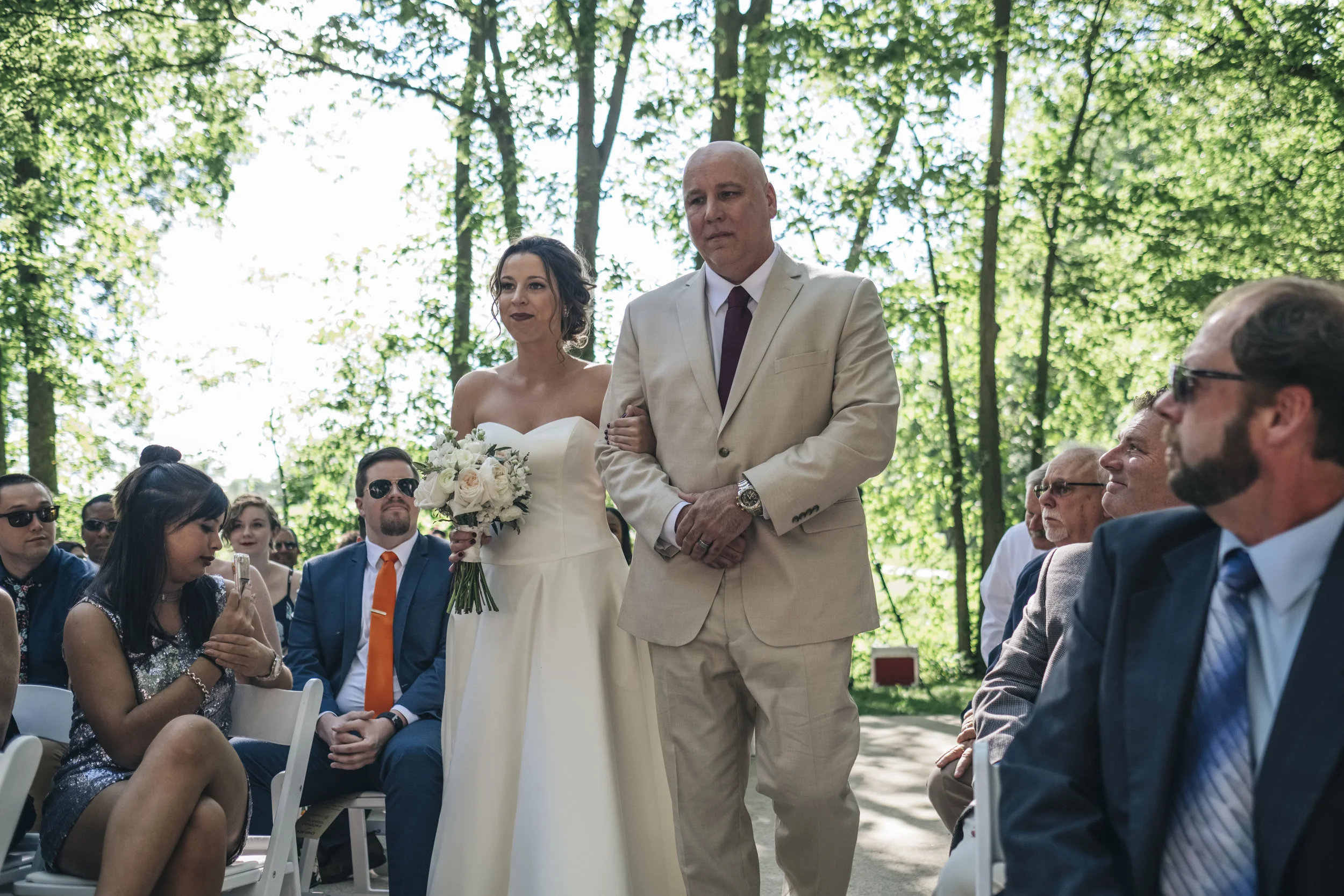 Father walks his daughter down the aisle at her wedding in Grand Rapids, Ohio. 