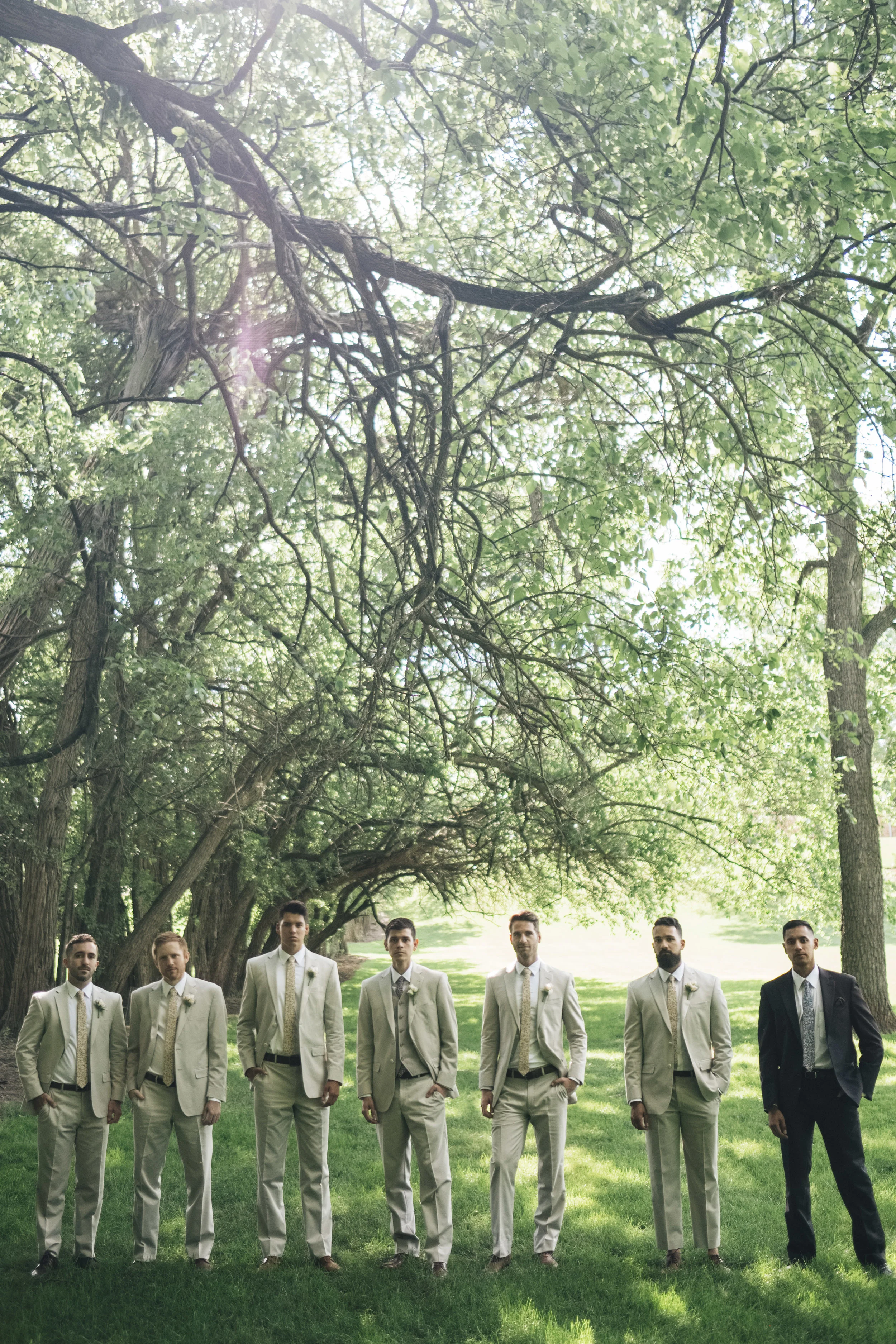 Portrait of the groom and groomsmen before the wedding ceremony at Nazareth Hall.