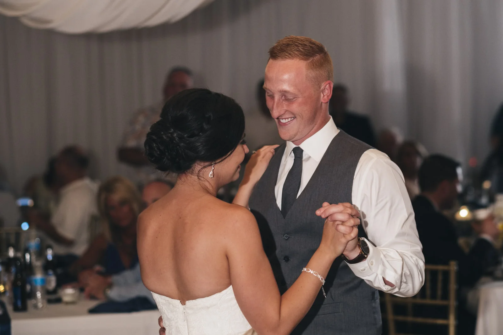 Bride and groom dance their first dance at St. Mary's wedding reception venue in northern Ohio