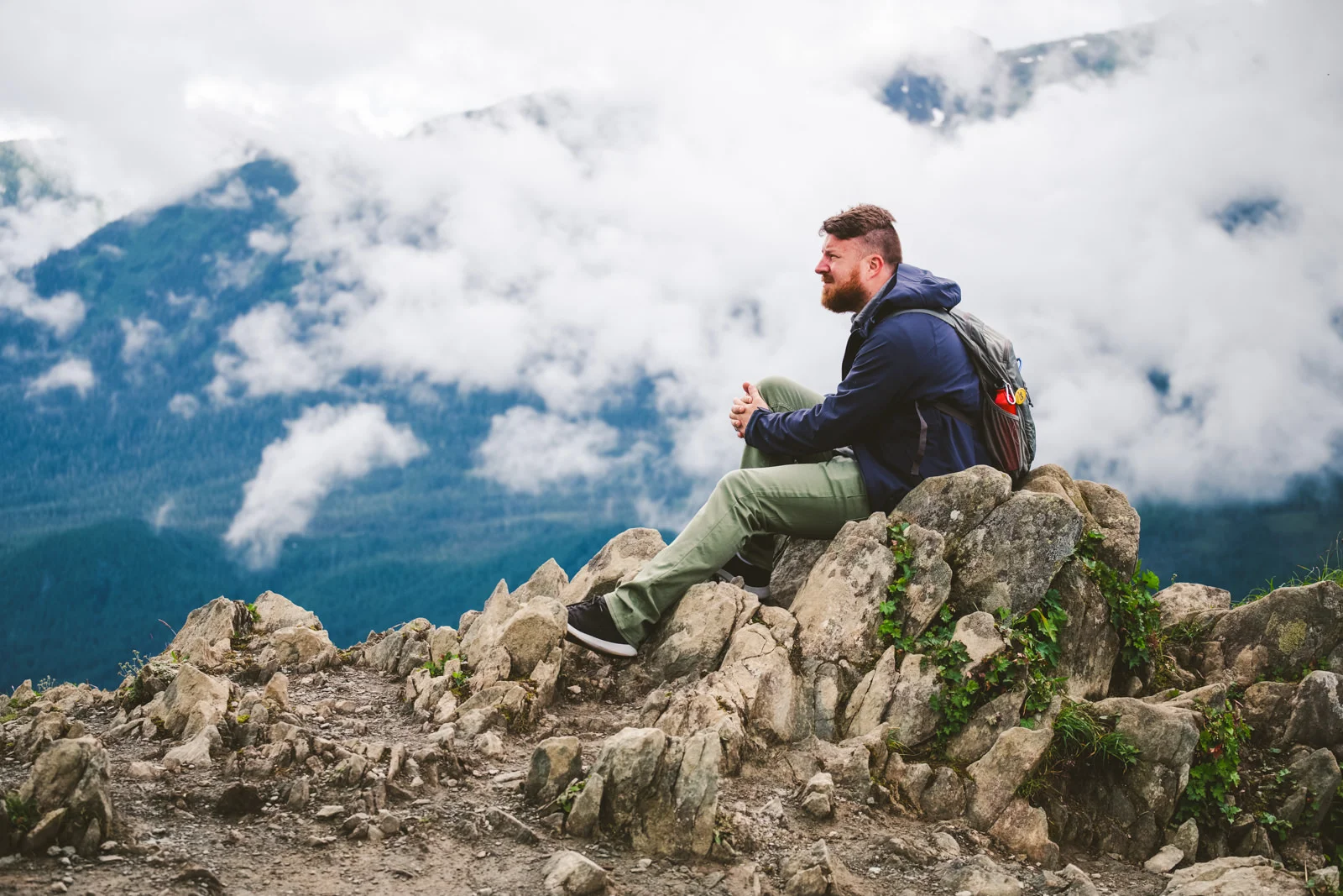 ohio destination wedding photographer sits on top of mountain in alaska