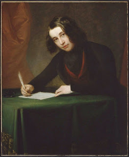  The illustration of a young Charles Dickens (about age 30 if the info is correct), is from Wikipedia—and quite a different look from the more familiar portraits of his older self.