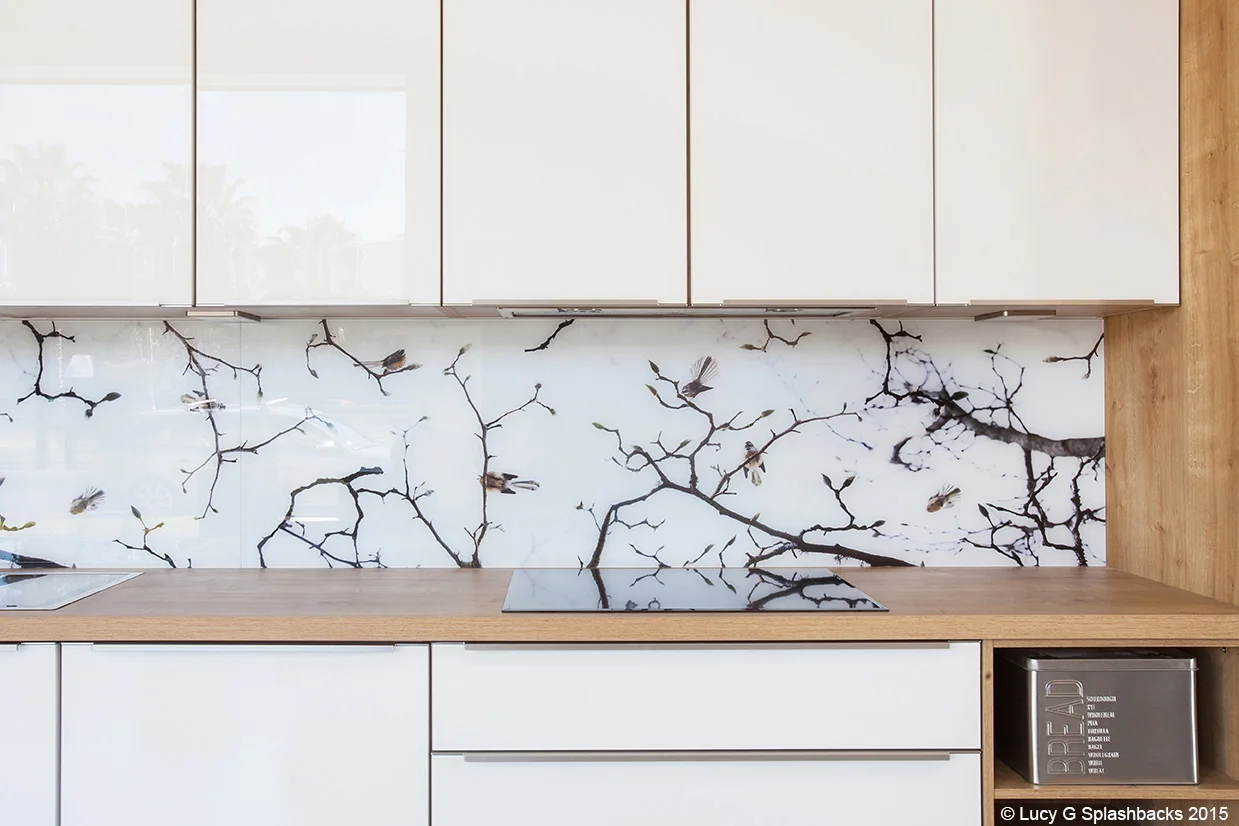 Fantails on blossoms splashback