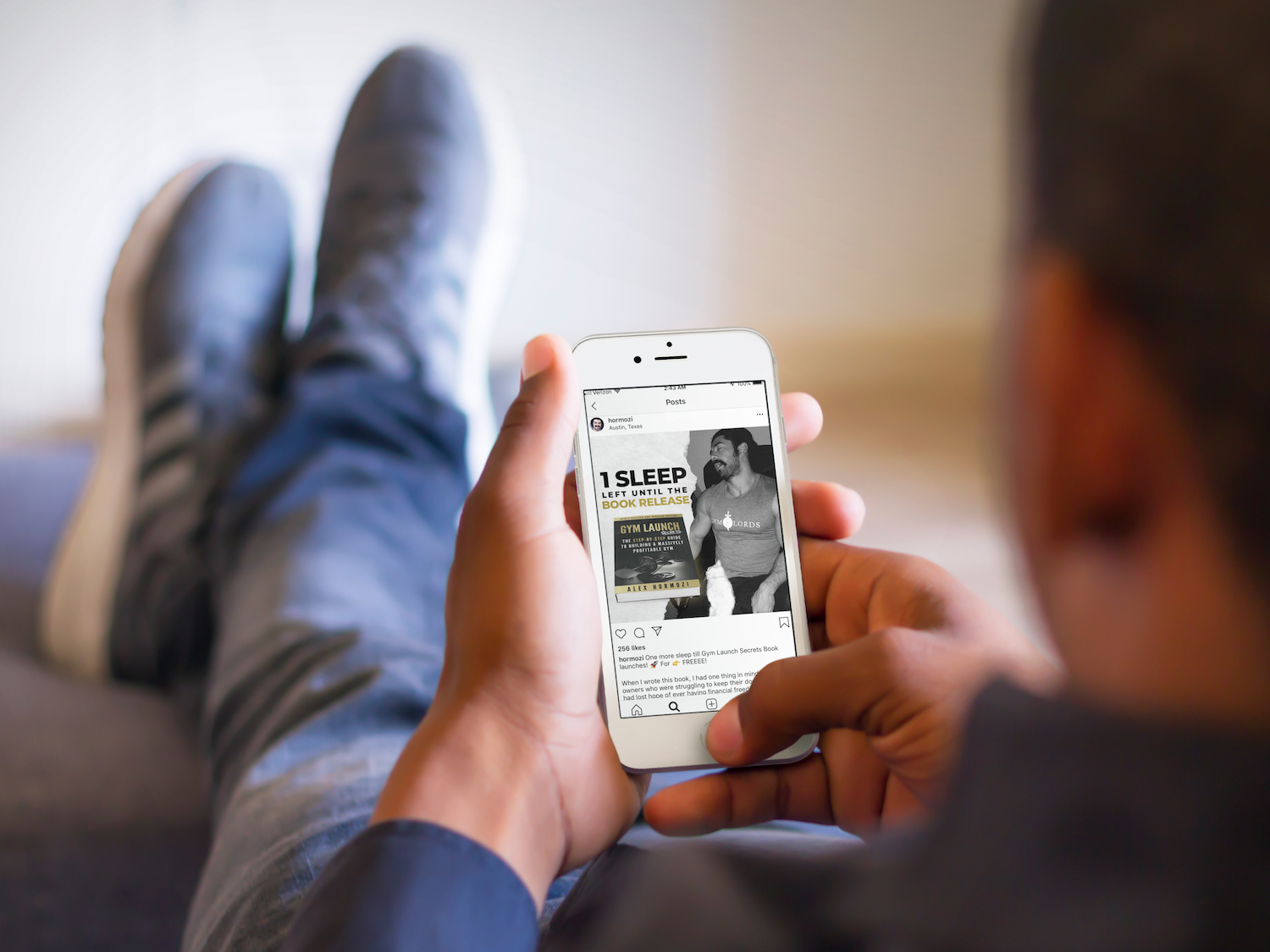 mockup-of-man-relaxing-with-his-feet-up-while-using-a-white-iphone-6.png
