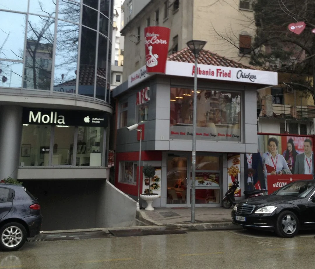 Two things are funny in this picture I took while in Tirana. One is the obvious rip-off of KFC (logo, fonts and all). The other is to the left - the supposed authorized reseller of Apple products, the name of the store is "Molla" - Albanian for Apple. Now you know.