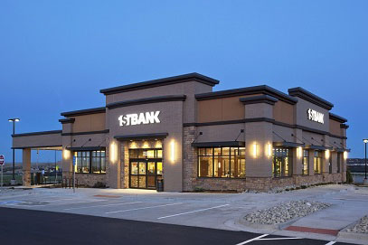For this new branch of 1stBank in Aurora, the bank employed beautiful wood framing to accompany its style. 