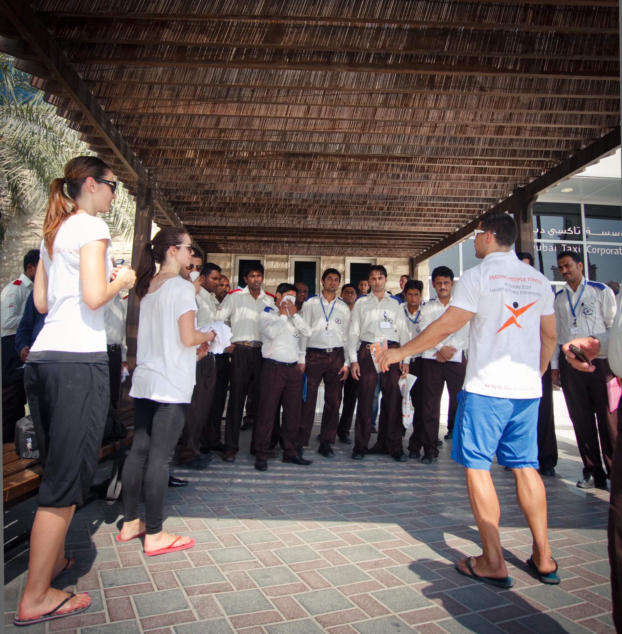  FitnessLink Co-Founder Grant Goes demonstrates some stretches and offers health advice to a group of RTA Taxi Drivers. 