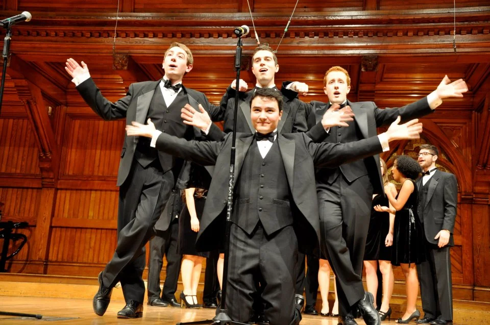 Ciaran Foley '15, Dylan Schaffer '16, Zach Bernstein '13, and Michael Senter-Zapata '14 (front) pip for "River of Dreams" during "Black Ties, Blue Velvet," Fall Jam 2012.