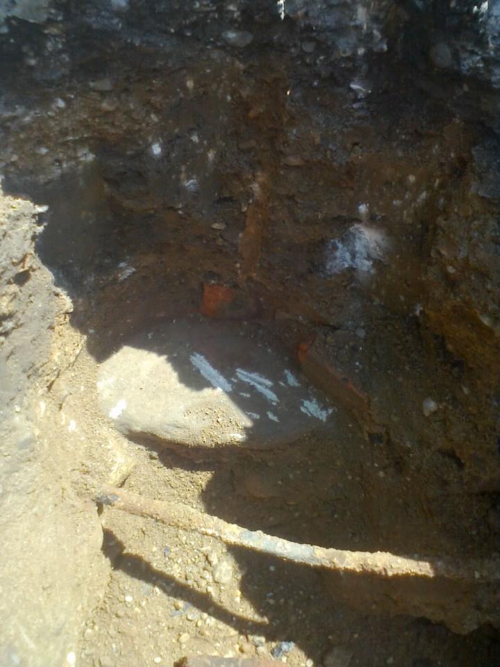 Stone with brick fragments set over top (set circa 1885) for the E 1/4 Corner, Section 12, Alamo Township, Kalamazoo County, recovered August 2011