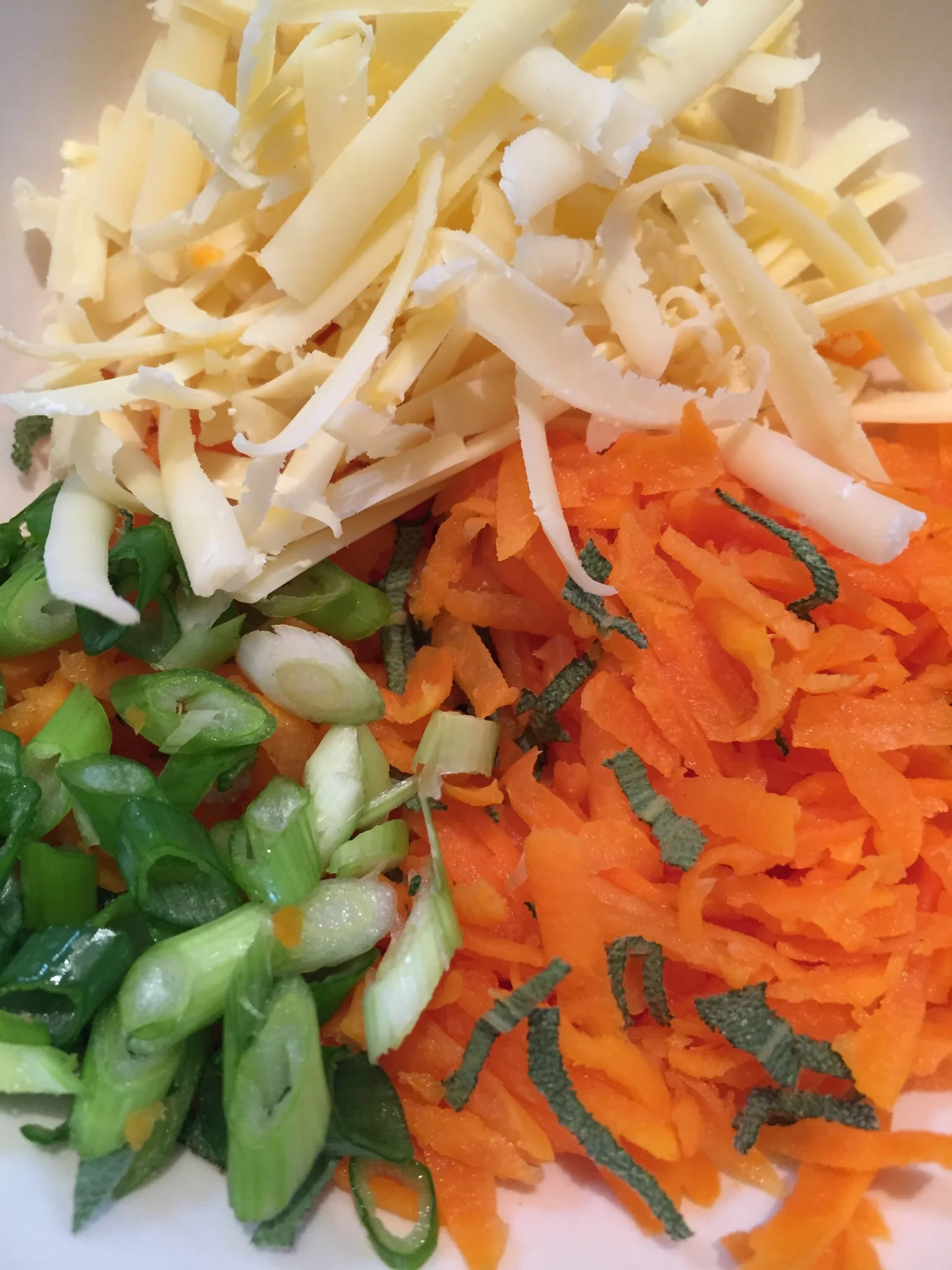 Grated carrot, cheese, Spring onions, sage and lemon zest