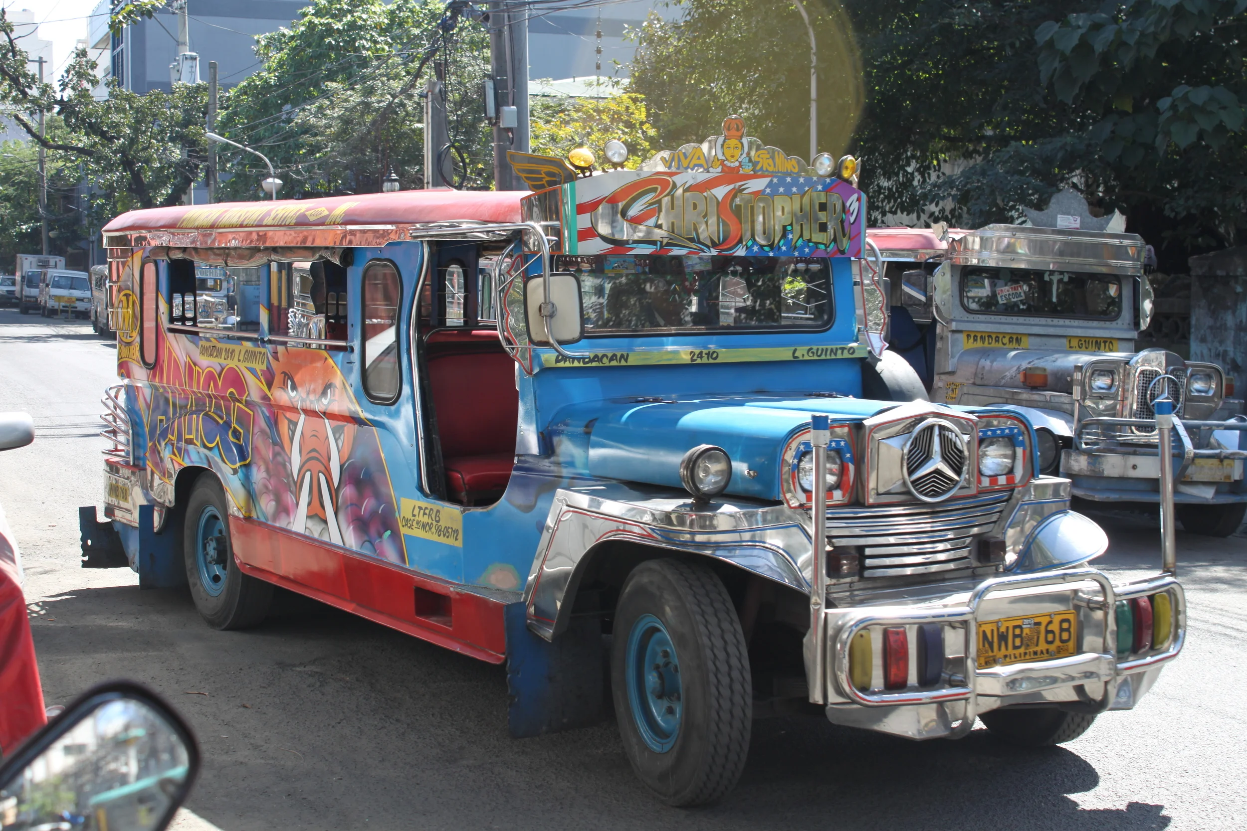 one of the many jeepneys that dot manila's streets.