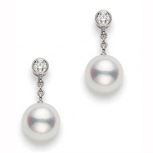 Mikimoto droplet earrings in pearl and diamond.