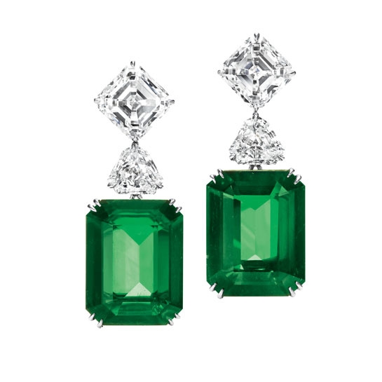Harry Winston earrings in emerald, platinum, and diamond.