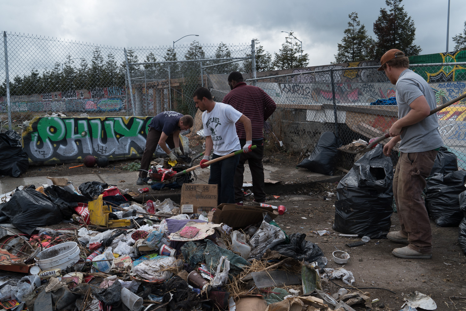 Cleaning up the trash dumped in the cul-de-sac is a never-ending task.