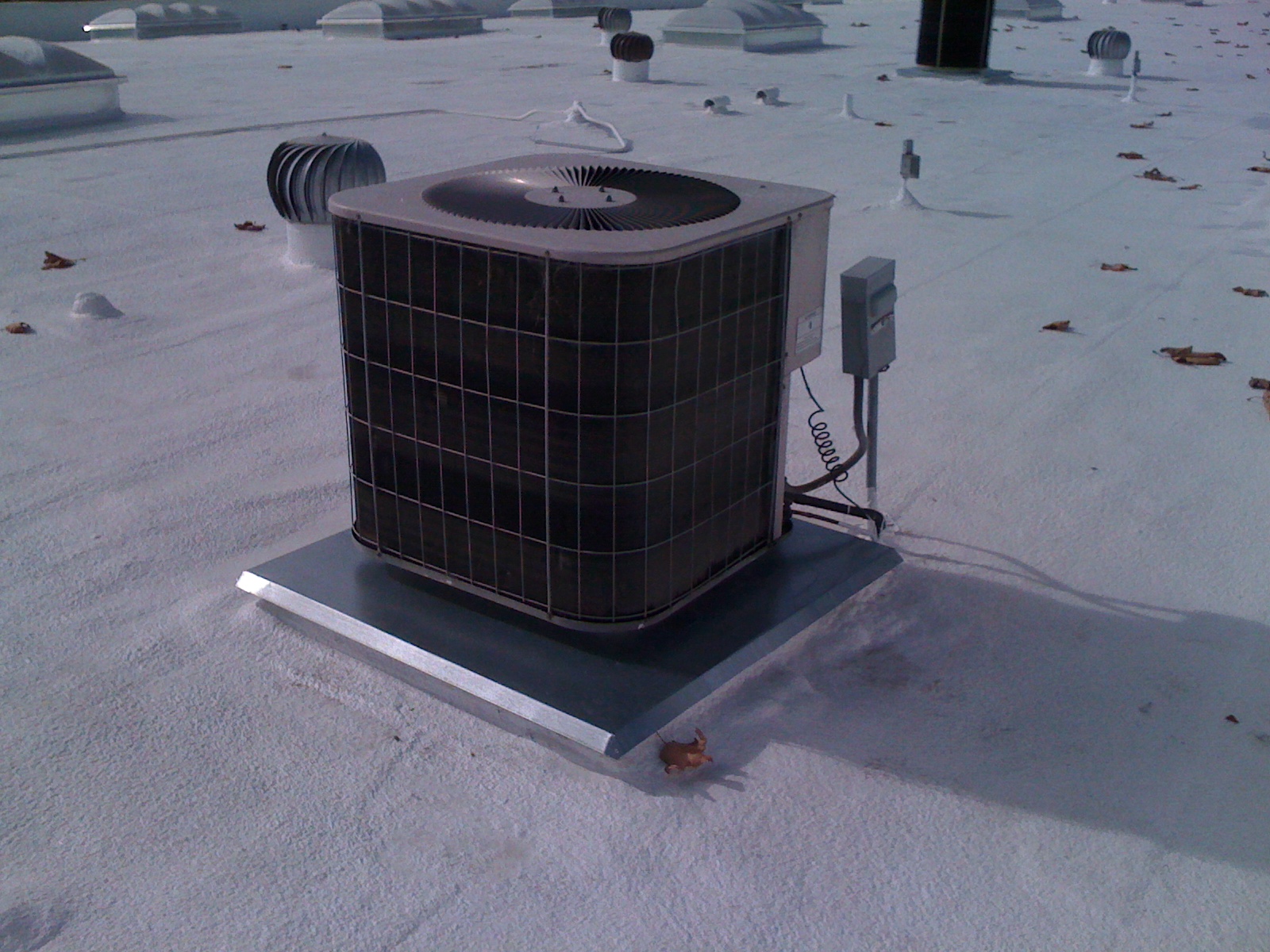  Warehouse: another AC unit mounted on a wooden curb, waterproofed with SPF and custom sheet metal pan 