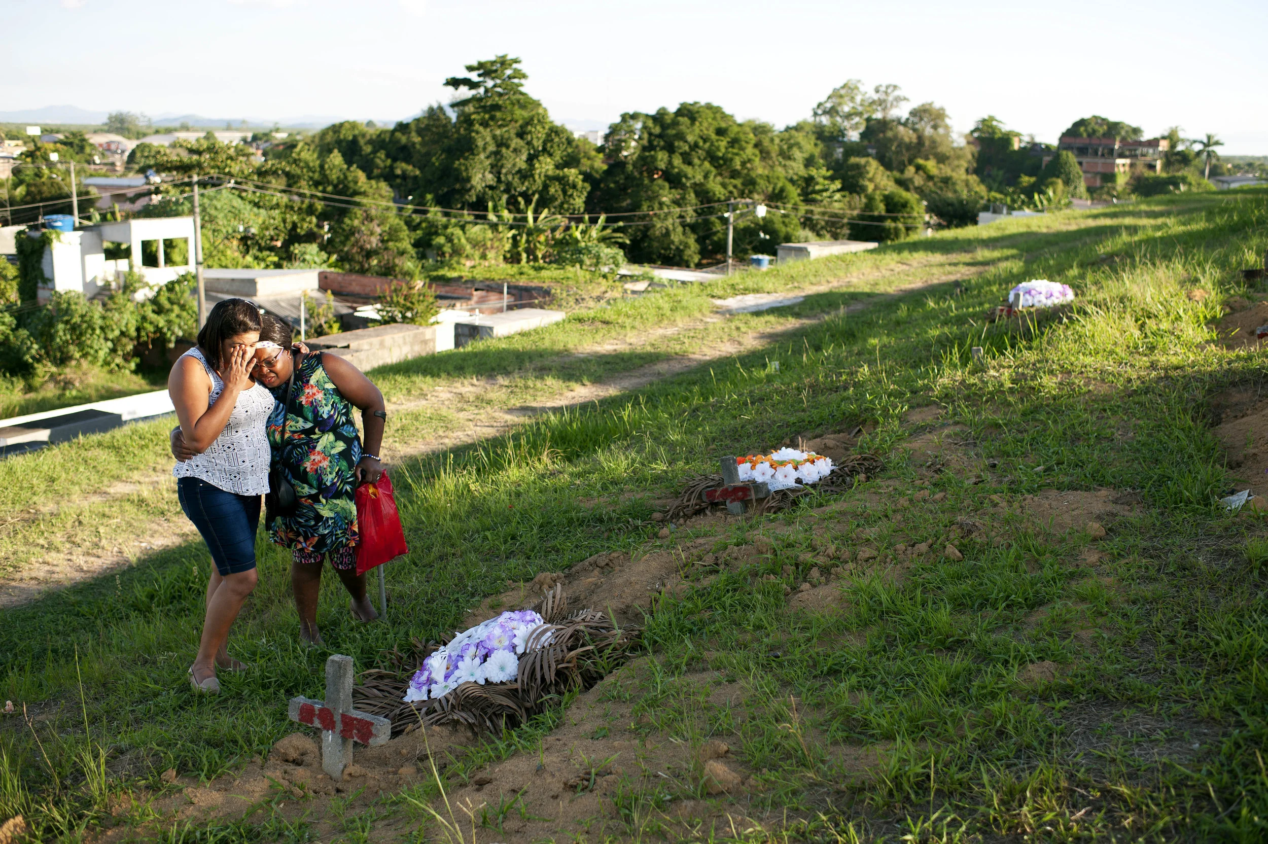 Michele Bittencourt, mother of Matheus Bittencourt, 18 years old, murdered in the Maricá massacre, and Maria Georgina da Silva, aunt-grandmother visit for the first time the boy's tomb at the Nossa Senhora da Piedade II Cemetery. He was a victim of what was known as ‘Maricá Chacina’, where five young men between the ages of 16 and 20 were murdered by militiamen with head shots.