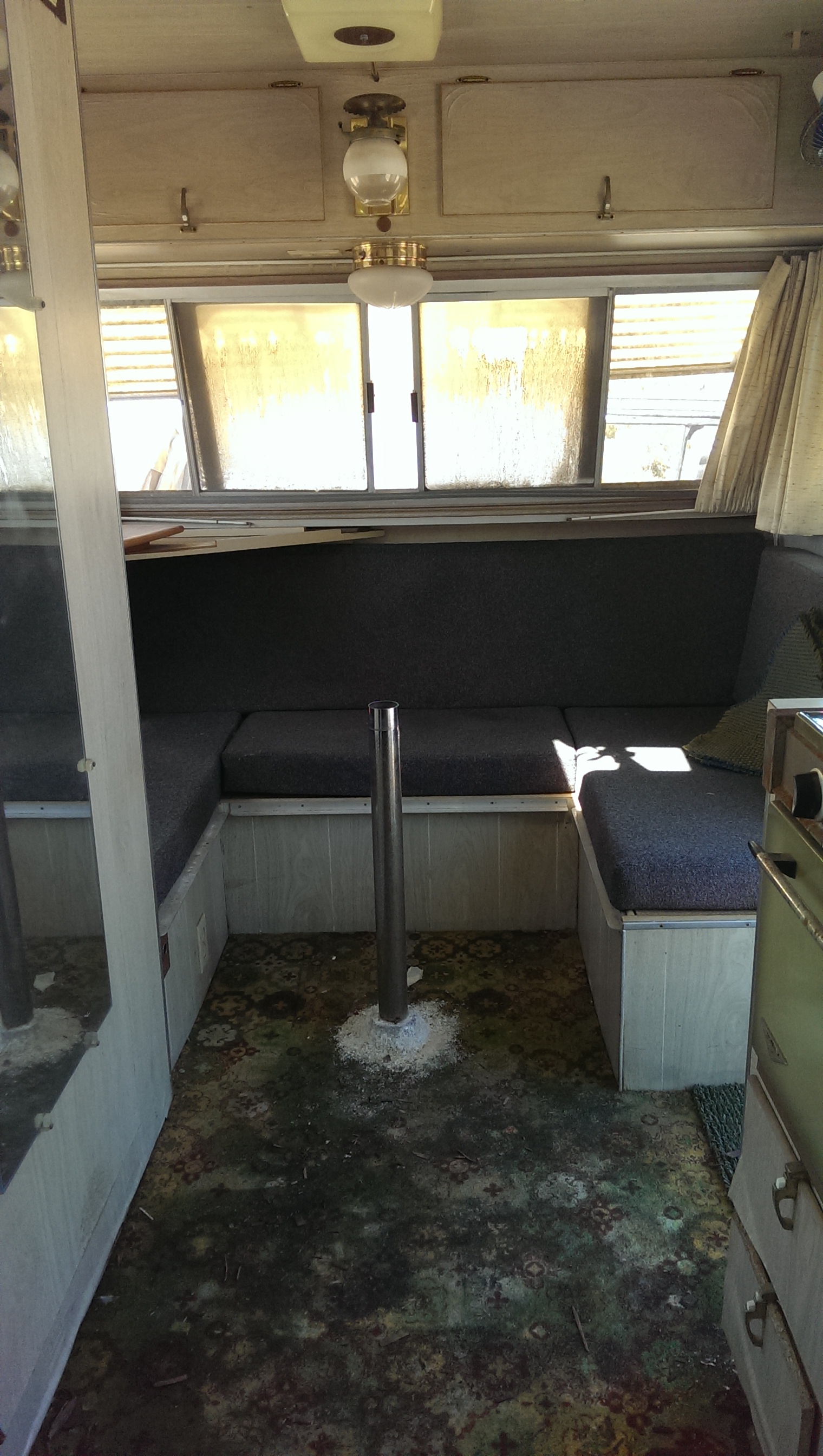 Nina will sleep here; the table post will come out and make a nice sized bed for her. She has also requested that a curtain be installed, which is not unreasonable. As you can see, the carpet is completely wrecked; taking it out will be the first order of business.