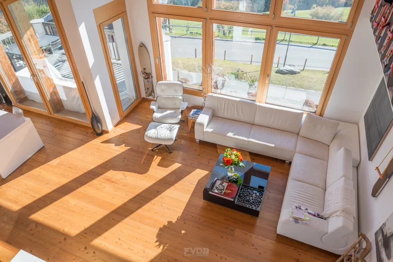 Looking down at the living room from the upstairs entertainment area