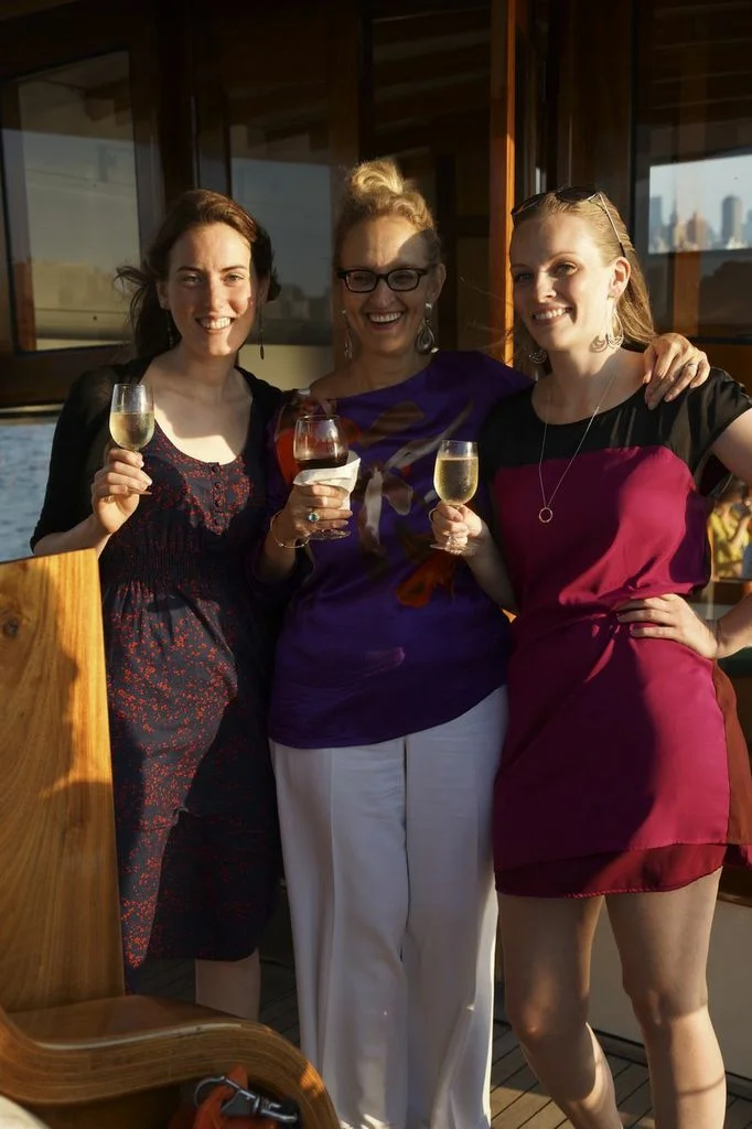Paralegal Clara Fox, bookkeeper Ada Biewald, and attorney Ashley Emerson, right before doing a shot of Jamieson.