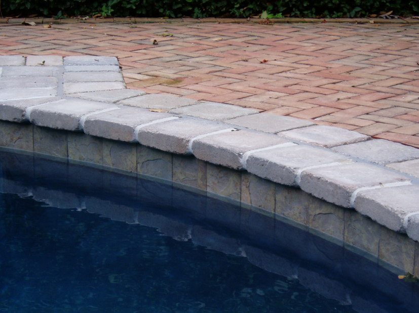 Tri-State project with stone look 6x6 waterline tile. Tumbled Paver coping, Dublin Cobble 9x9, Sheffield Blend and Colored Plaster interior finish.