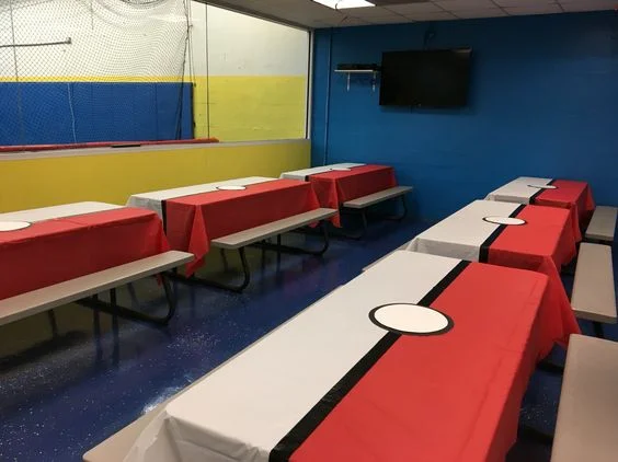 I love these party tables. They actually look quite easy to achieve, use the rolls of table cloth that you can get in all sorts of colours from places like Amazon. You can even overlap one colour over the other and use the black duct tape to cover up the overlap. The centre of the PokeBall tables look like a paper plate taped on using the duct tape. Quite simple but when you combine this with all the other decorations in this blog then party will just look awesome.