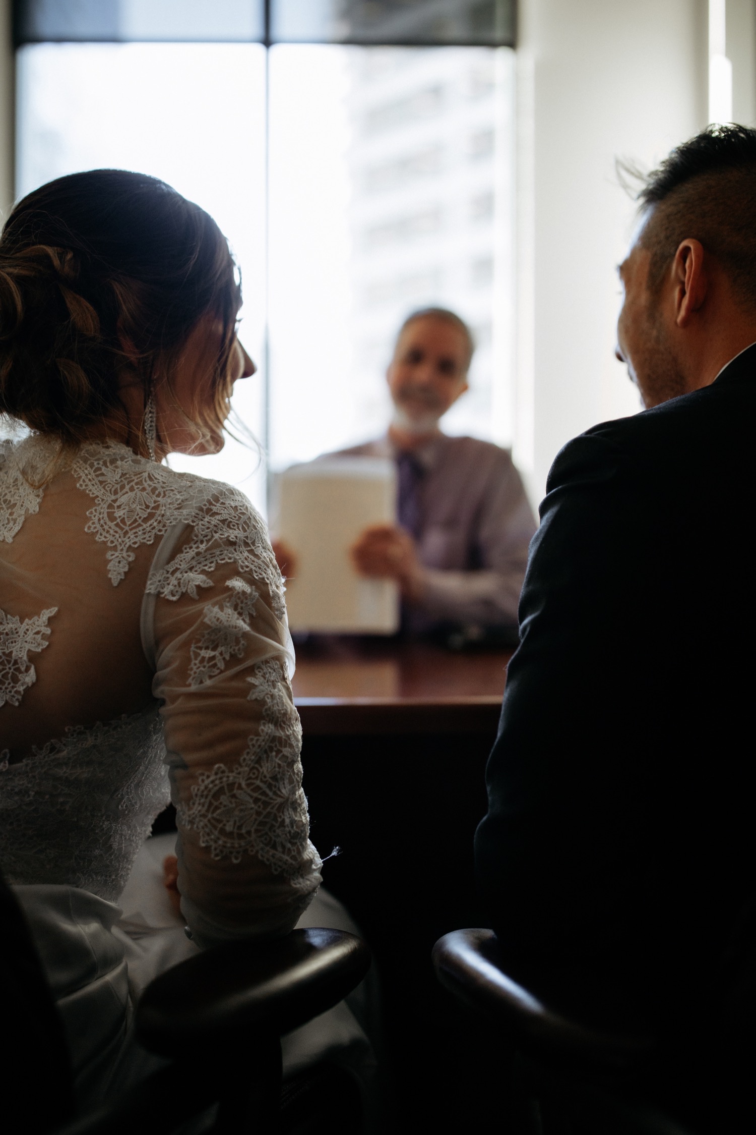 090_LJ-253_courthouse_zoeburchard_elopementphotographer_glamorous_elopement_zoeburchardstudio_seattlebride_weddingdress_thompsonhotel_pikeplace_citywedding_cityelopement_intimateelopement_courthousewedding_seattle_seattleelopement_bowtie.jpg