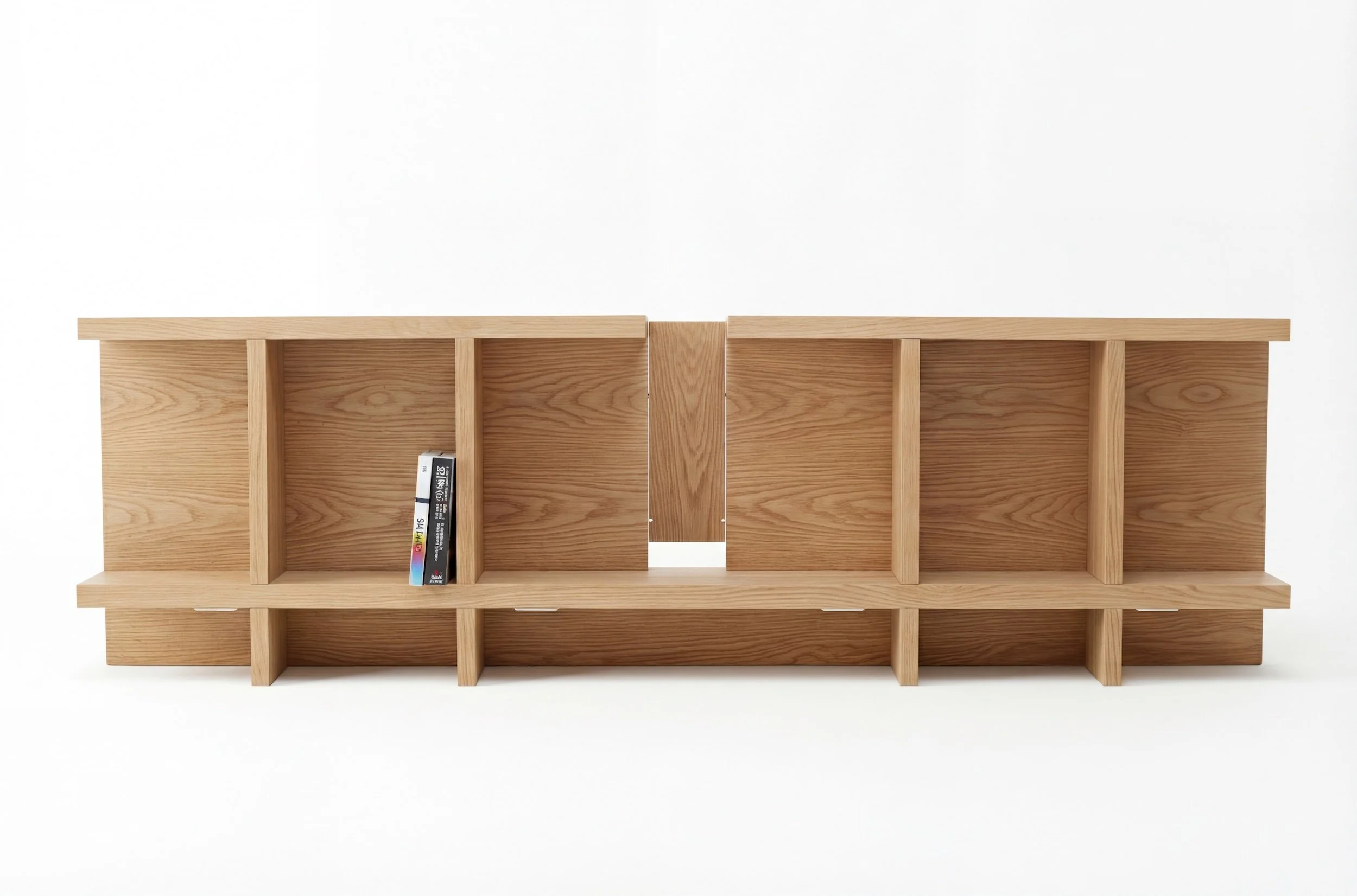 Conceived as a spatial sculpture, the structure can be deployed at the center of the room. The back of the headboard then reveals itself as an open architectural bookcase.