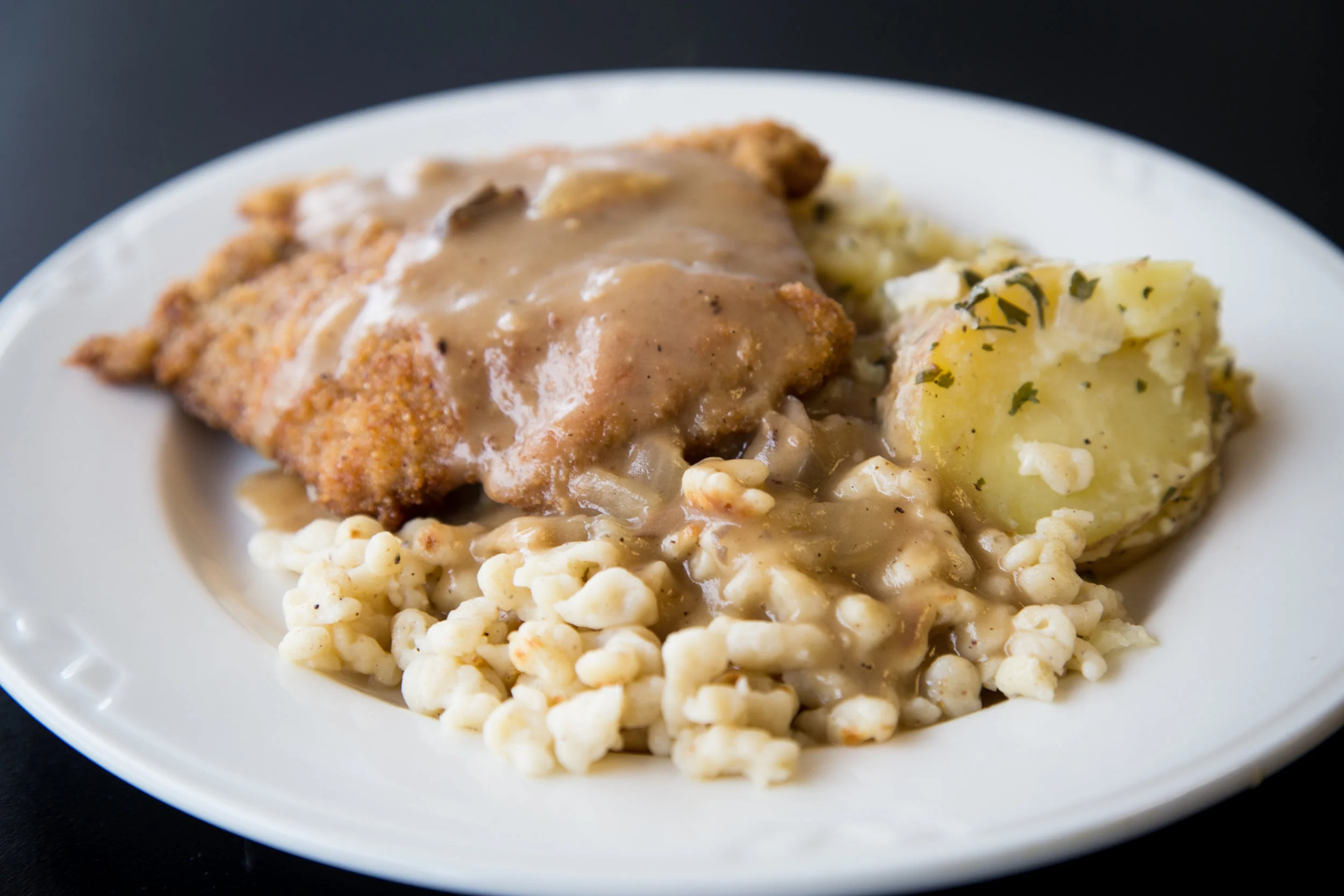 Pork Schnitzel with spaetzle made from scratch and potato salad.