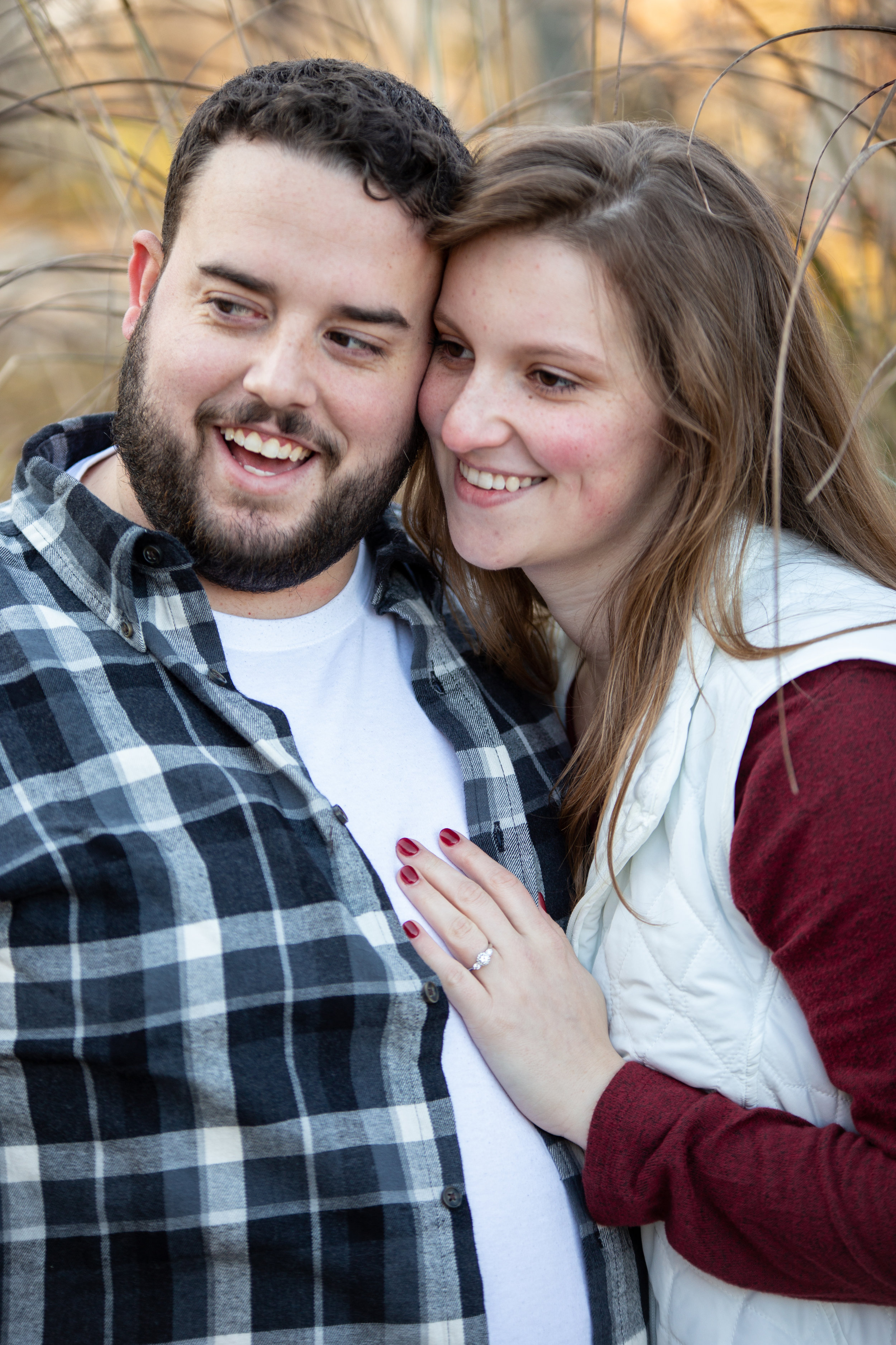Fall-Laughing-together-bench-trees-duck-pond-virginia-tech-blacksburg-roanoke-engaged-warm
