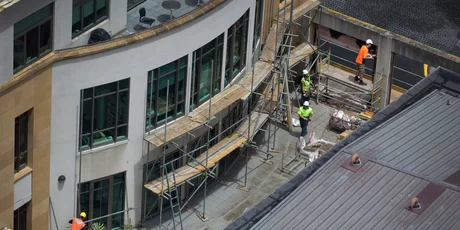 Contractors erect scaffolding at Chancery shopping centre in central Auckland in preparation for repair work. Photo / Sarah Ivey