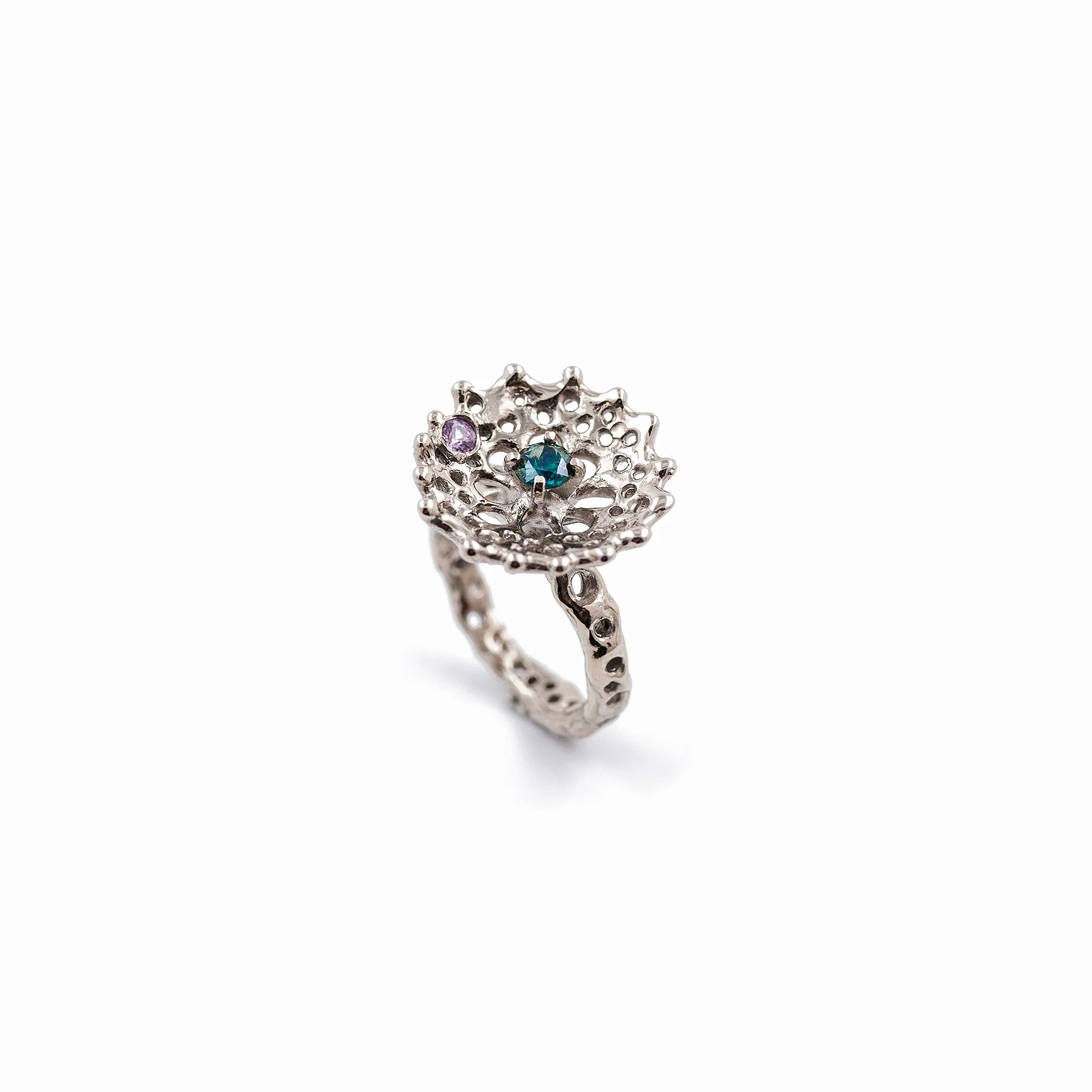 Radial Ring: An organic radial patterned ring of 18ct white gold holds a centrally set Australian blue sapphire and pink sapphire accent.