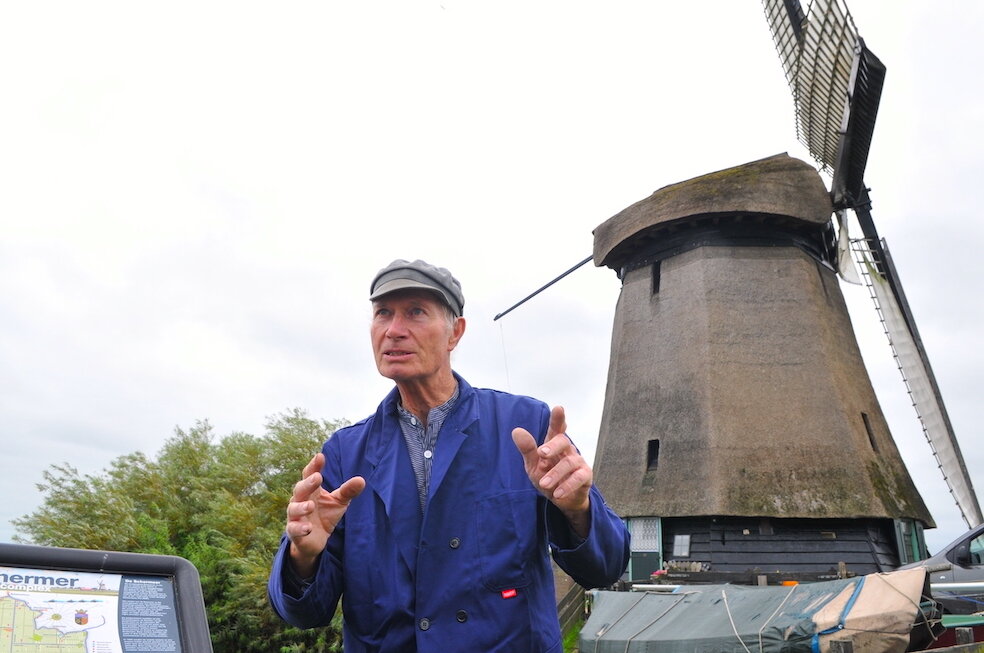 Windmill caretaker explaining the historic windmill