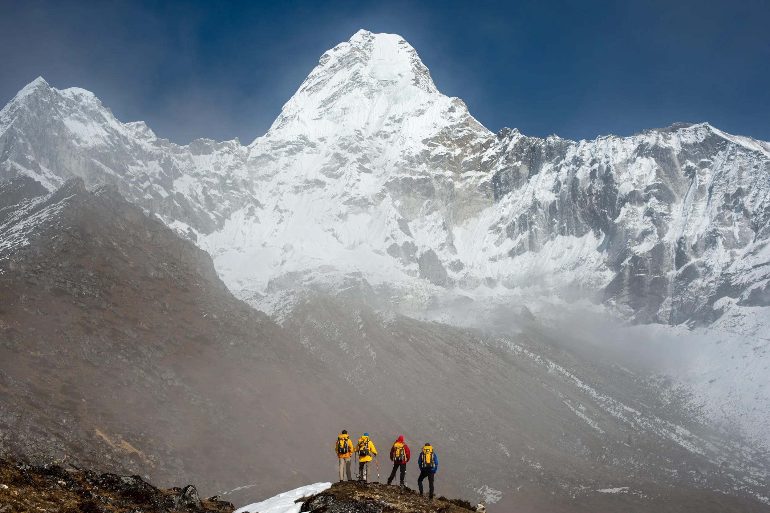 Nepal A team of climbers gaze up at the prospect ahead; Ama Dablam in the Khumbu region of Nepal