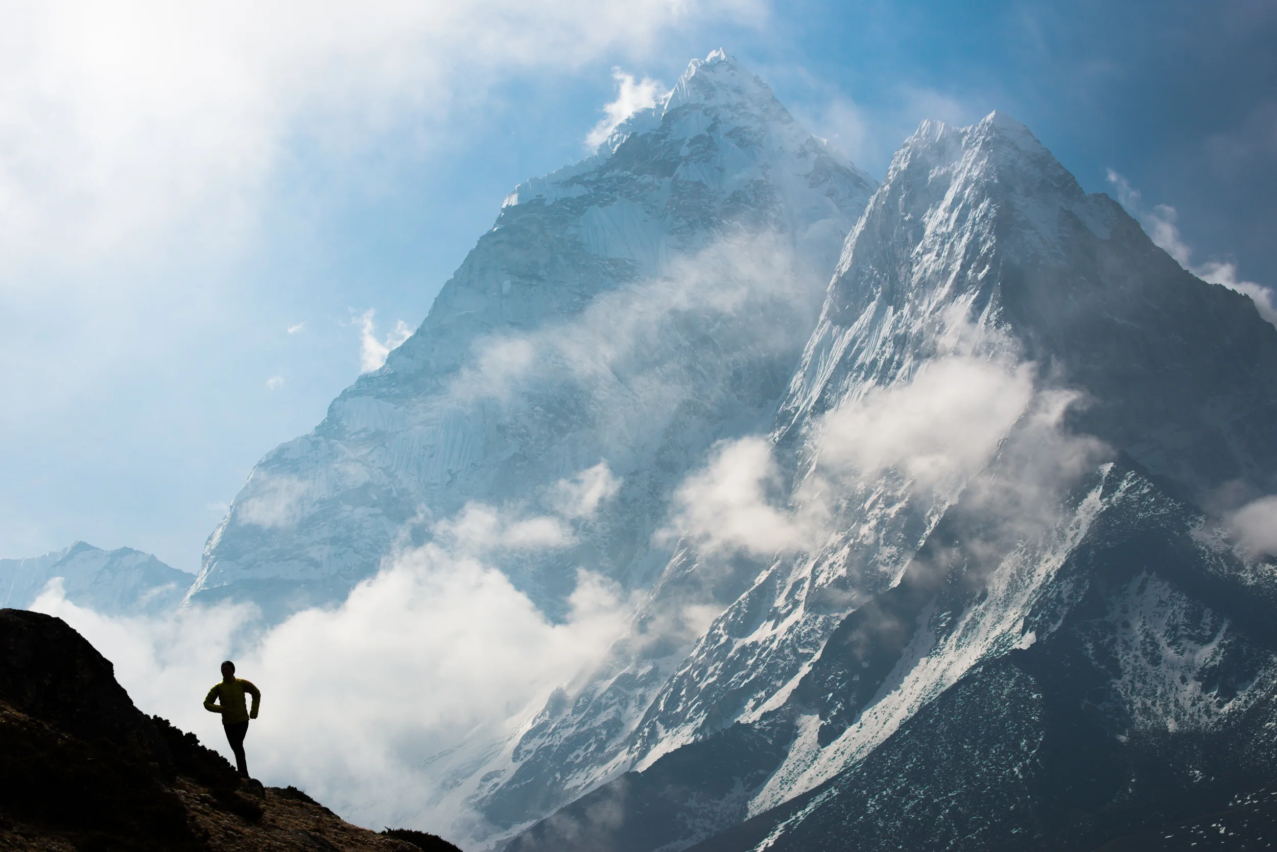 Nepal Lizzy Hawker – the 100km world champion runner – while competing in the Everest Base Camp to Kathmandu Mailrun: A sleepless 3 day, 319km journey with over 10,000m of ascent and descent. Here Lizzy runs with with views of Ama Dablam behind