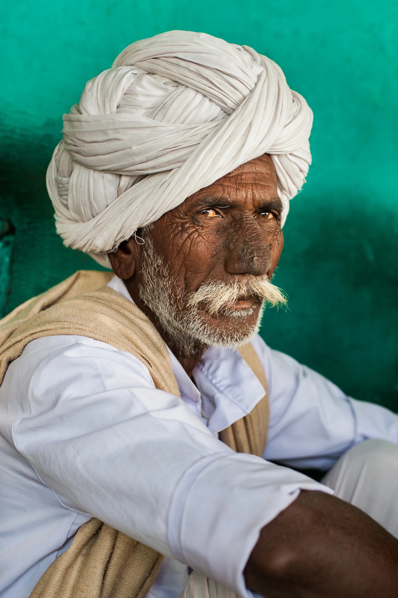 India - Rajasthan After a hard day working in the fields this old Rajasthani farmer enjoys a rest in a small chai shop near Bundi