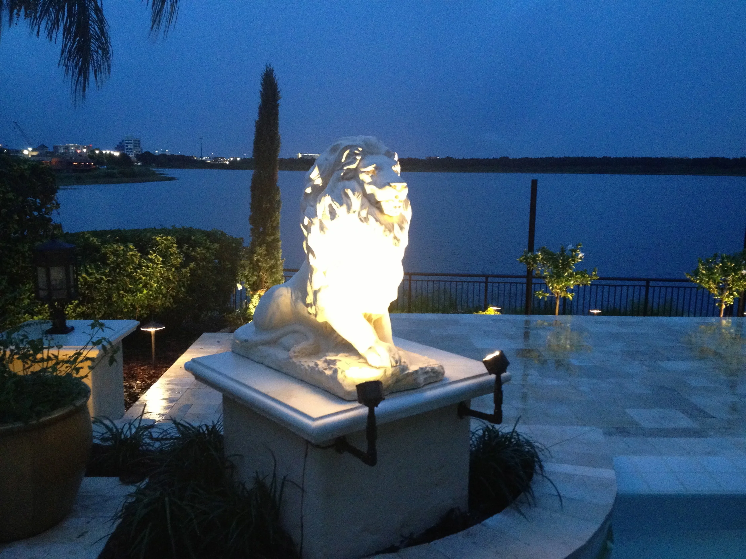Beautiful Lion Statuary Fountains express the elegance of this Travertine Pool Deck.