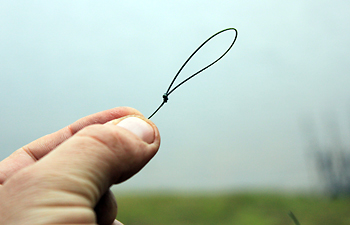 3) Tie a large loop In one end with an overhand knot, bear in mind that the size of the loop you are tying will represent the height of the finished popup.