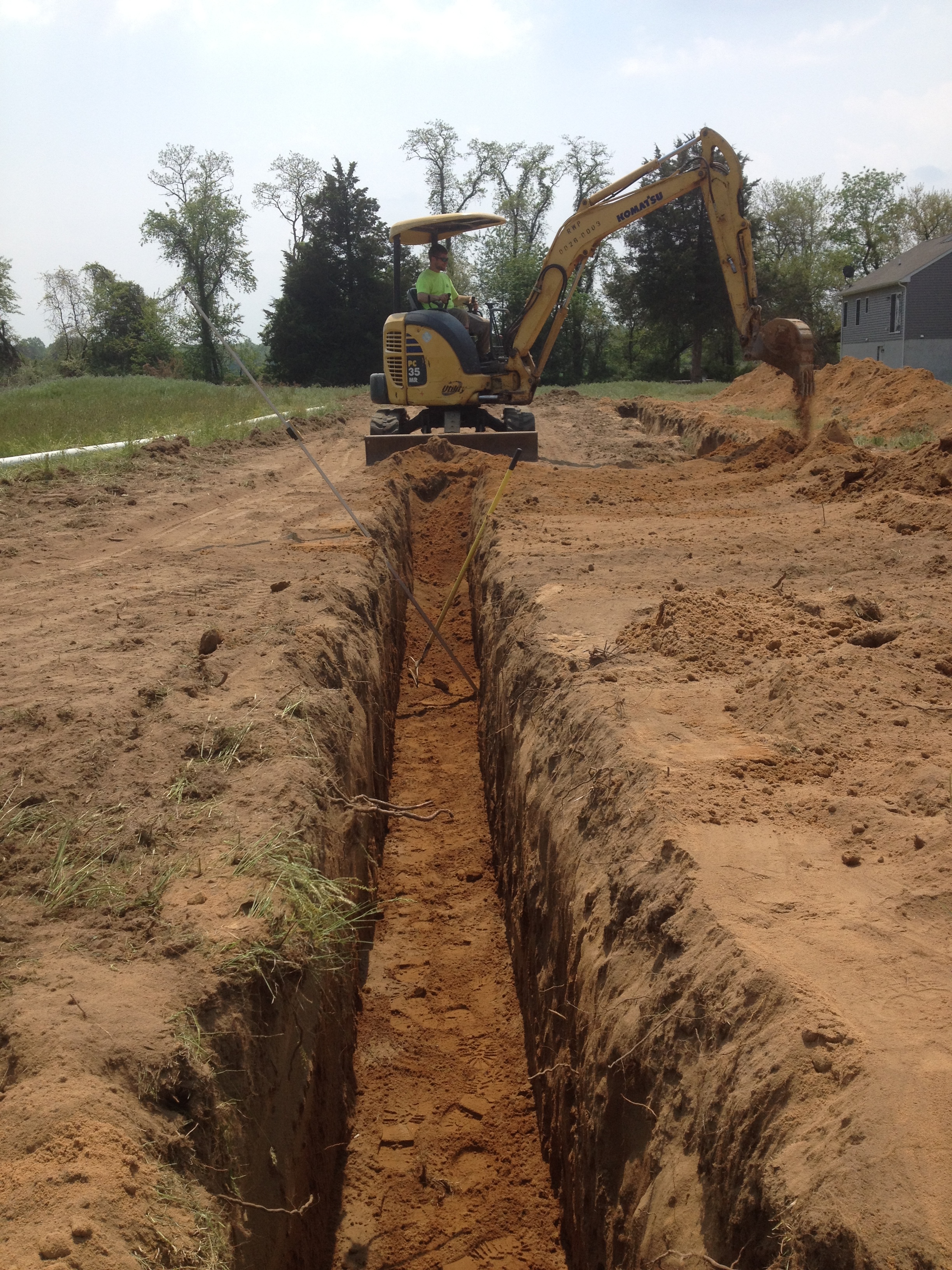 Excavator prepping septic drain fields | Shore Quality Contracting, LLC