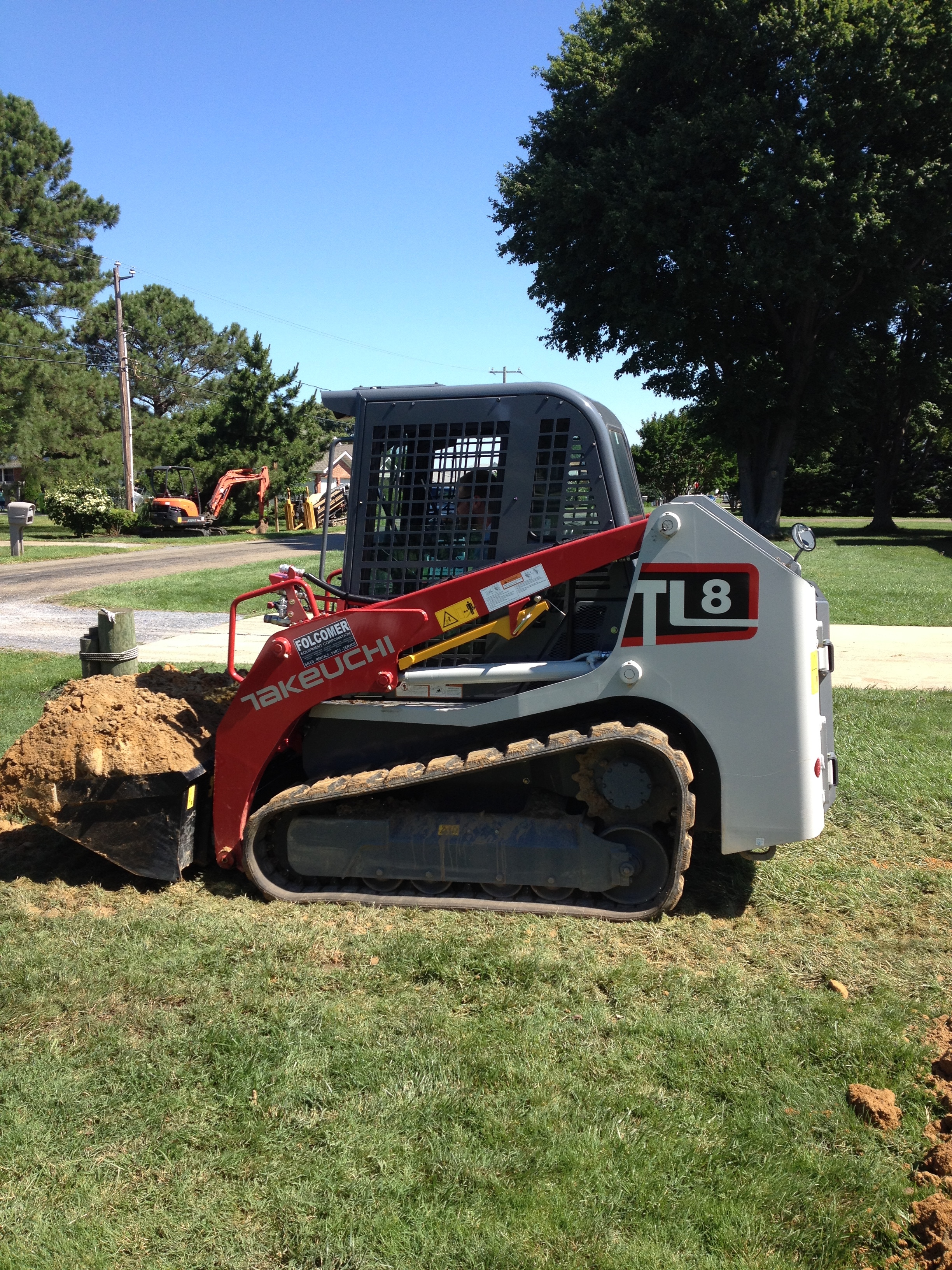 Loader hauling dirt for septic install | Shore Quality Contracting, LLC