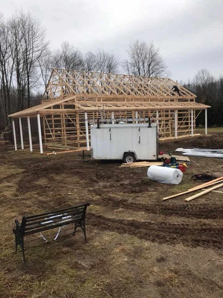 construction of pole building wood trusses completed