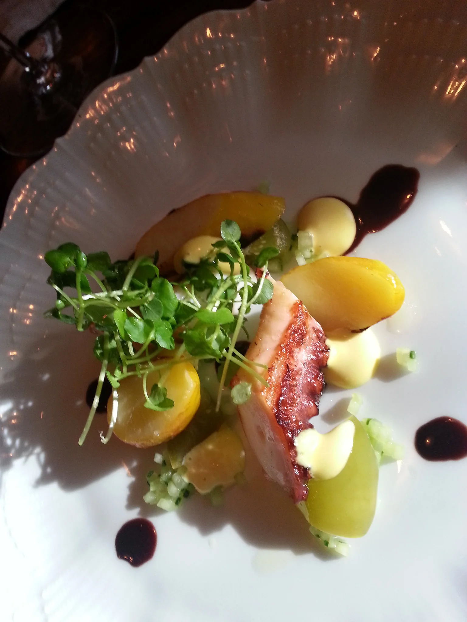 BBQ Octopus with potato, pickled tomatillo, cucumber, and black olive at Maude | FOODABLE WEBTV NETWORK