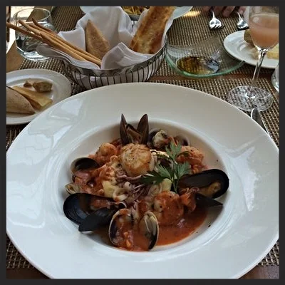 Fresh seafood over polenta ay East 12th Osteria | YELP, Page M. 