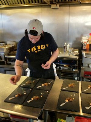 Chef at El Ideas prepares dishes in front of diners | YELP