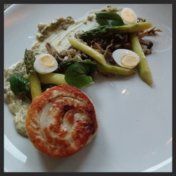 Flounder with quail eggs, asparagus, and mushrooms at Liquid Art House | Credit: Yelp, Kailey O.