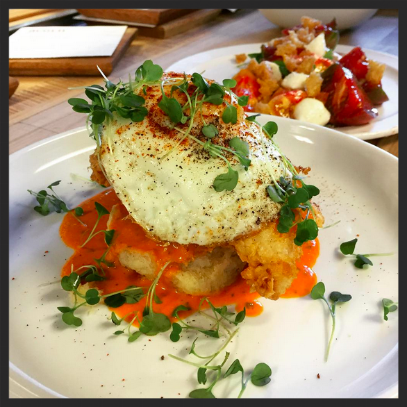 Fried chicken and biscuit at Acorn | Instagram, @acorn_denver